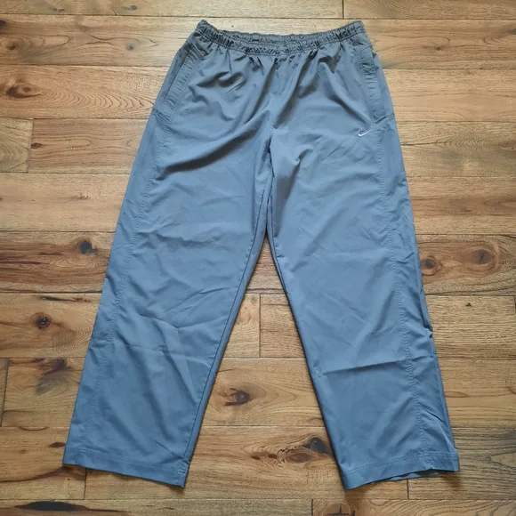 Nike pants with zipper at ankle on sale